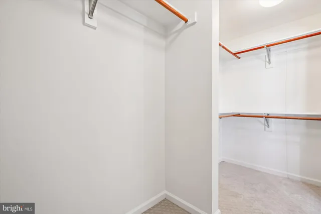 a picture of a bench in front of a wall