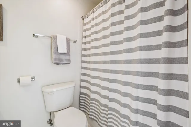 a view of a cars park in front of a building