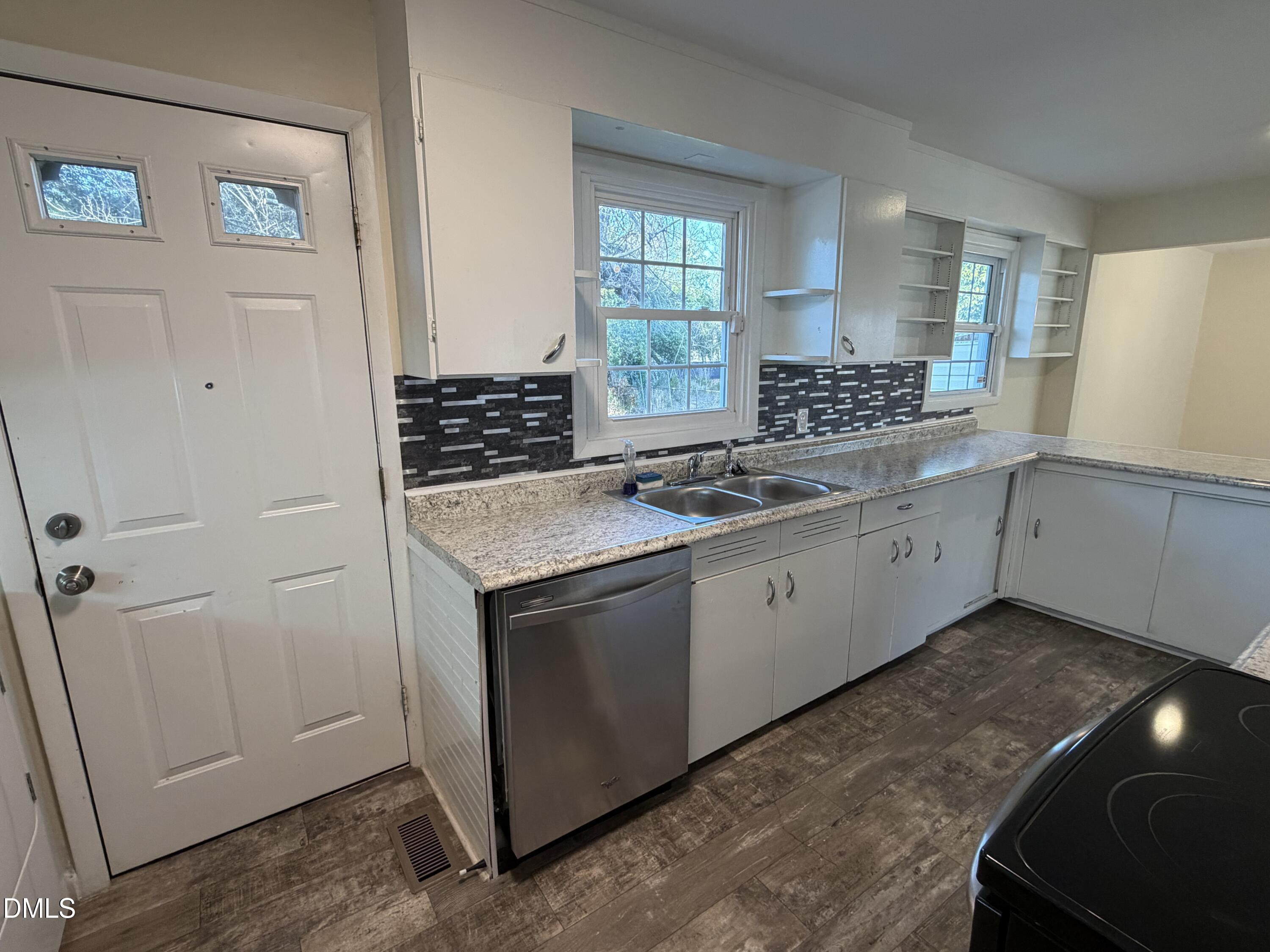 503 Spring Avenue Spring Lake, NC 28390 - Photo 11 of 36 a kitchen with a sink stove and cabinets