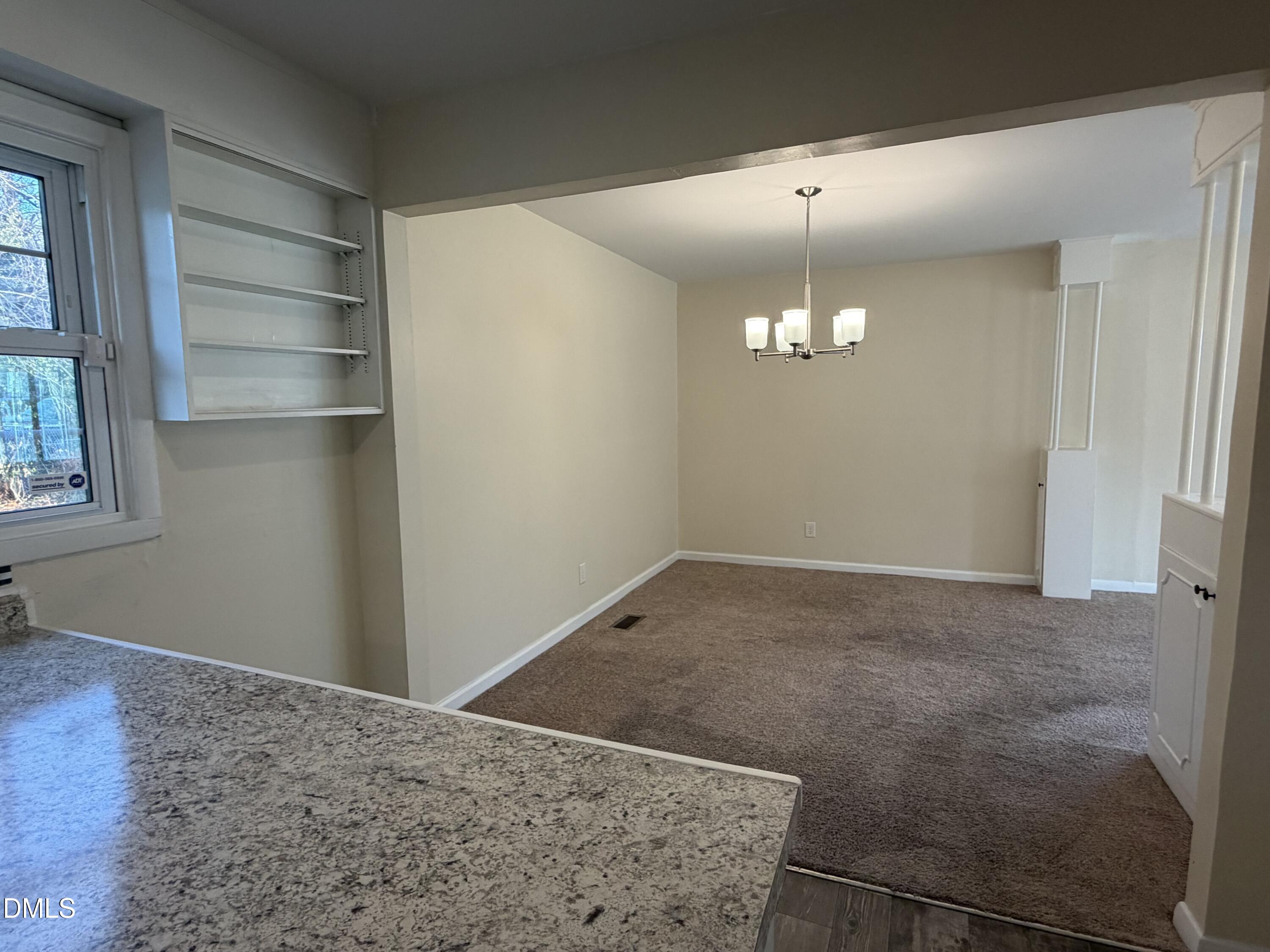 503 Spring Avenue Spring Lake, NC 28390 - Photo 16 of 36 a view of a livingroom with a chandelier fan