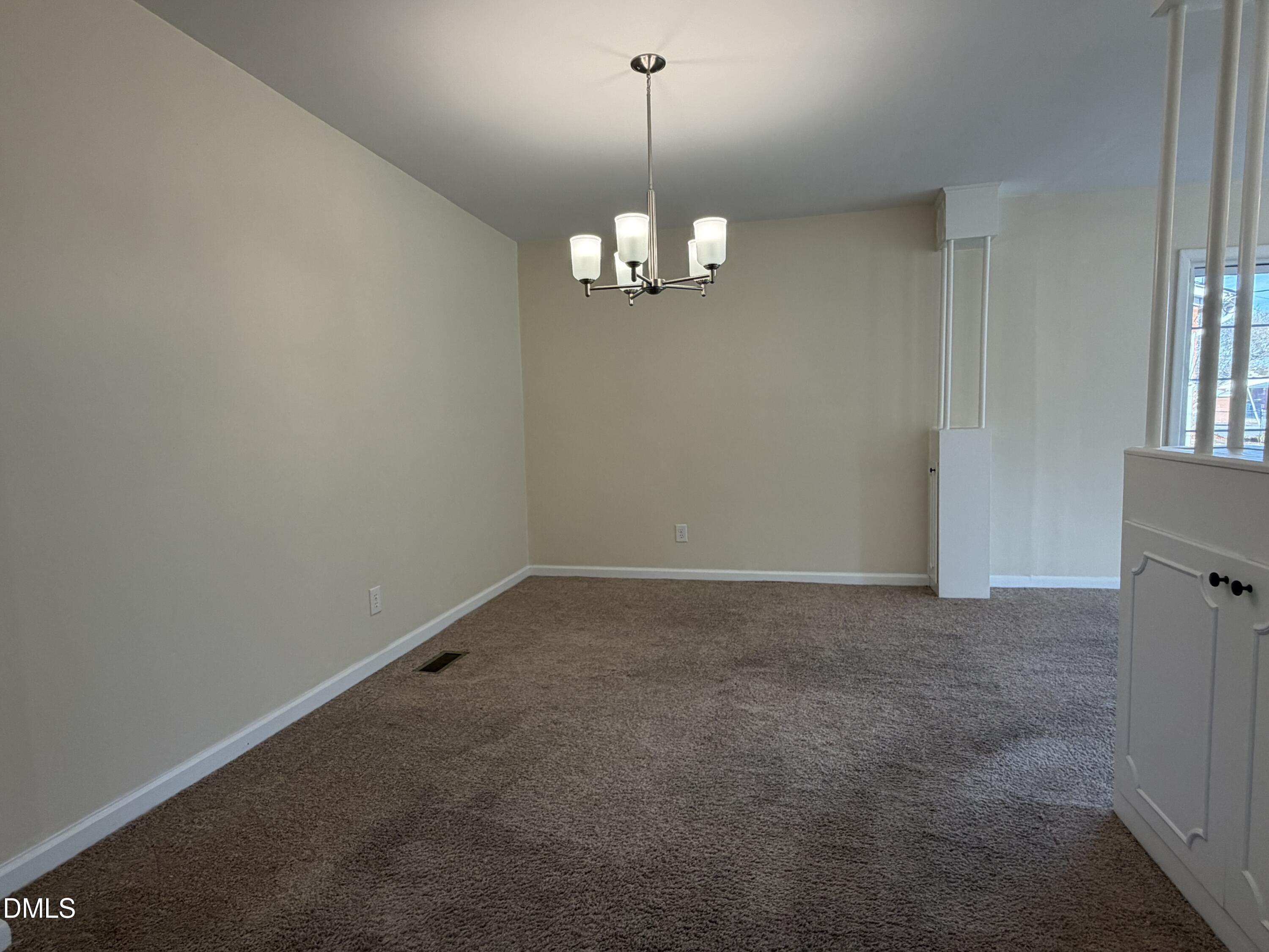 503 Spring Avenue Spring Lake, NC 28390 - Photo 17 of 36 a view of a room with a chandelier fan