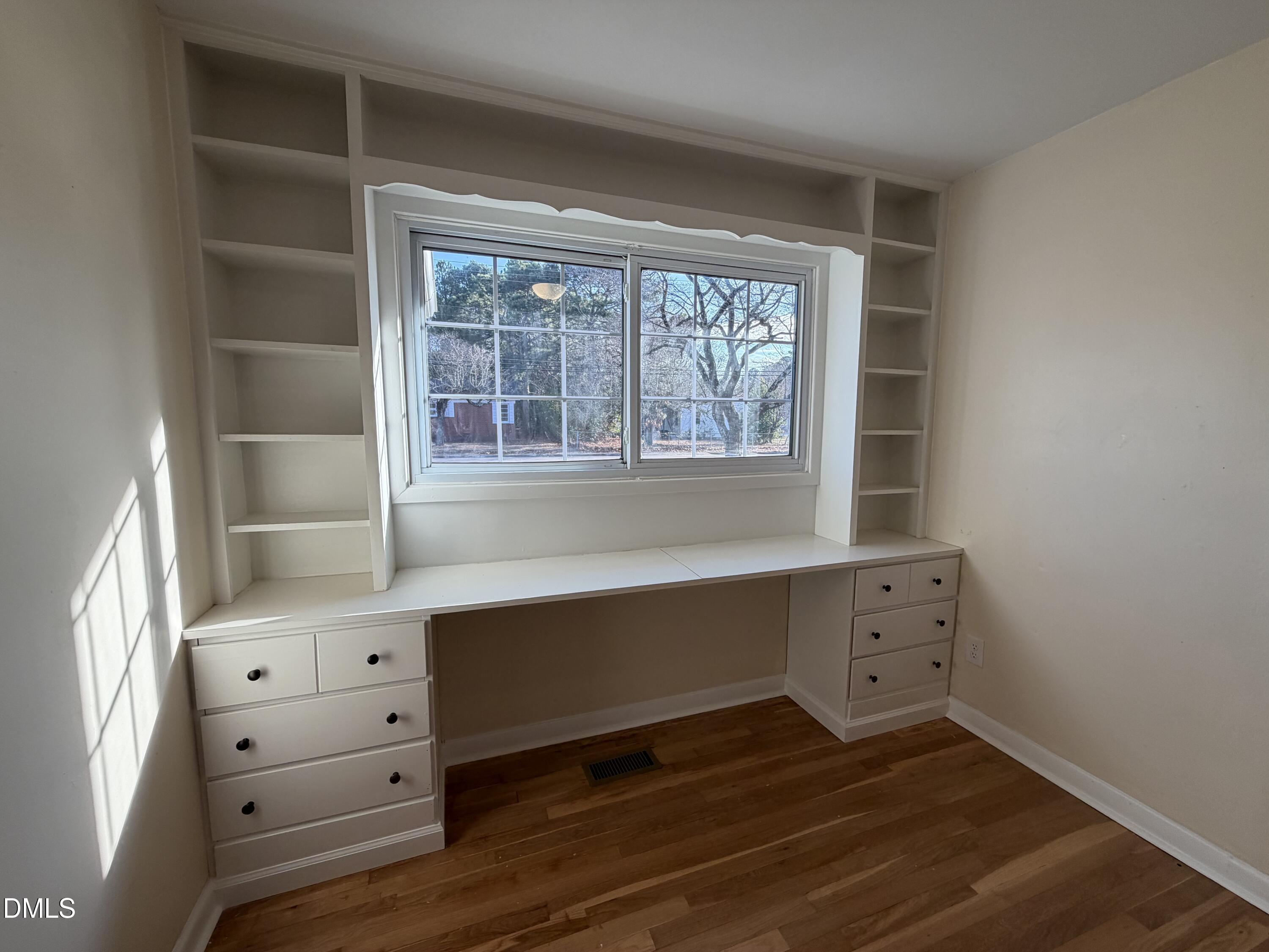 503 Spring Avenue Spring Lake, NC 28390 - Photo 19 of 36 a room with a dresser and a window
