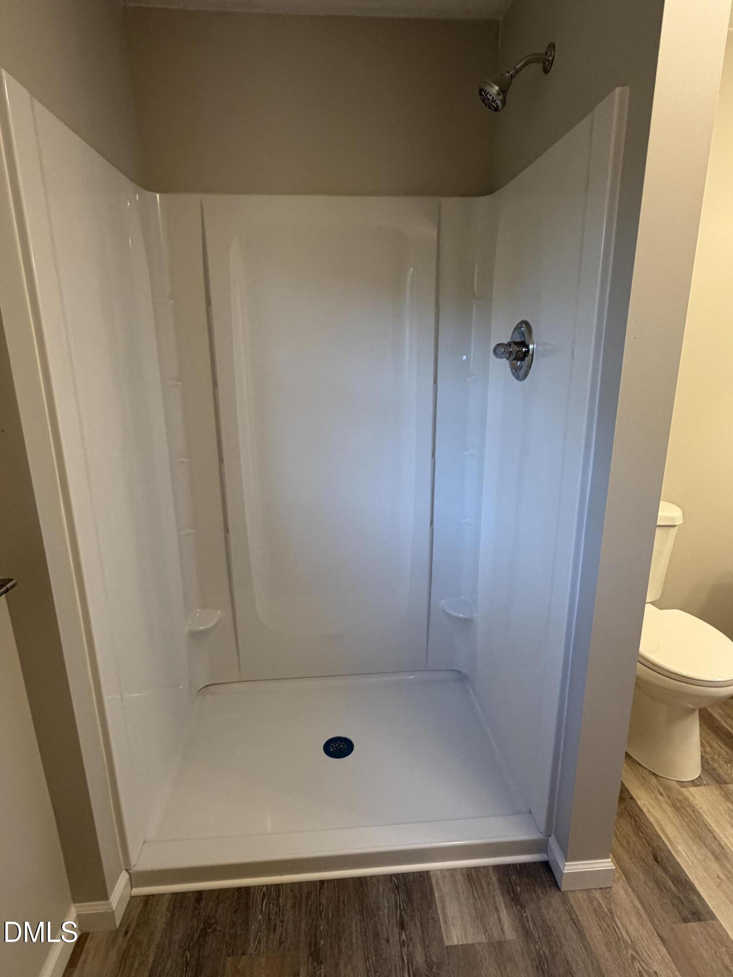 503 Spring Avenue Spring Lake, NC 28390 - Photo 28 of 36 a bathroom with a shower and toilet