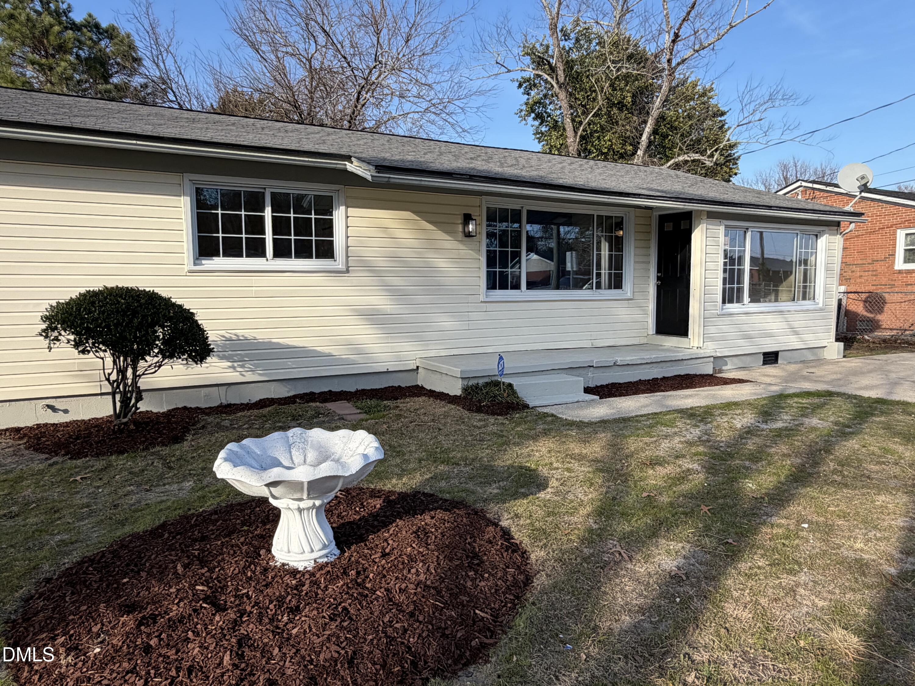 503 Spring Avenue Spring Lake, NC 28390 - Photo 3 of 36 a view of a house with backyard and sitting area