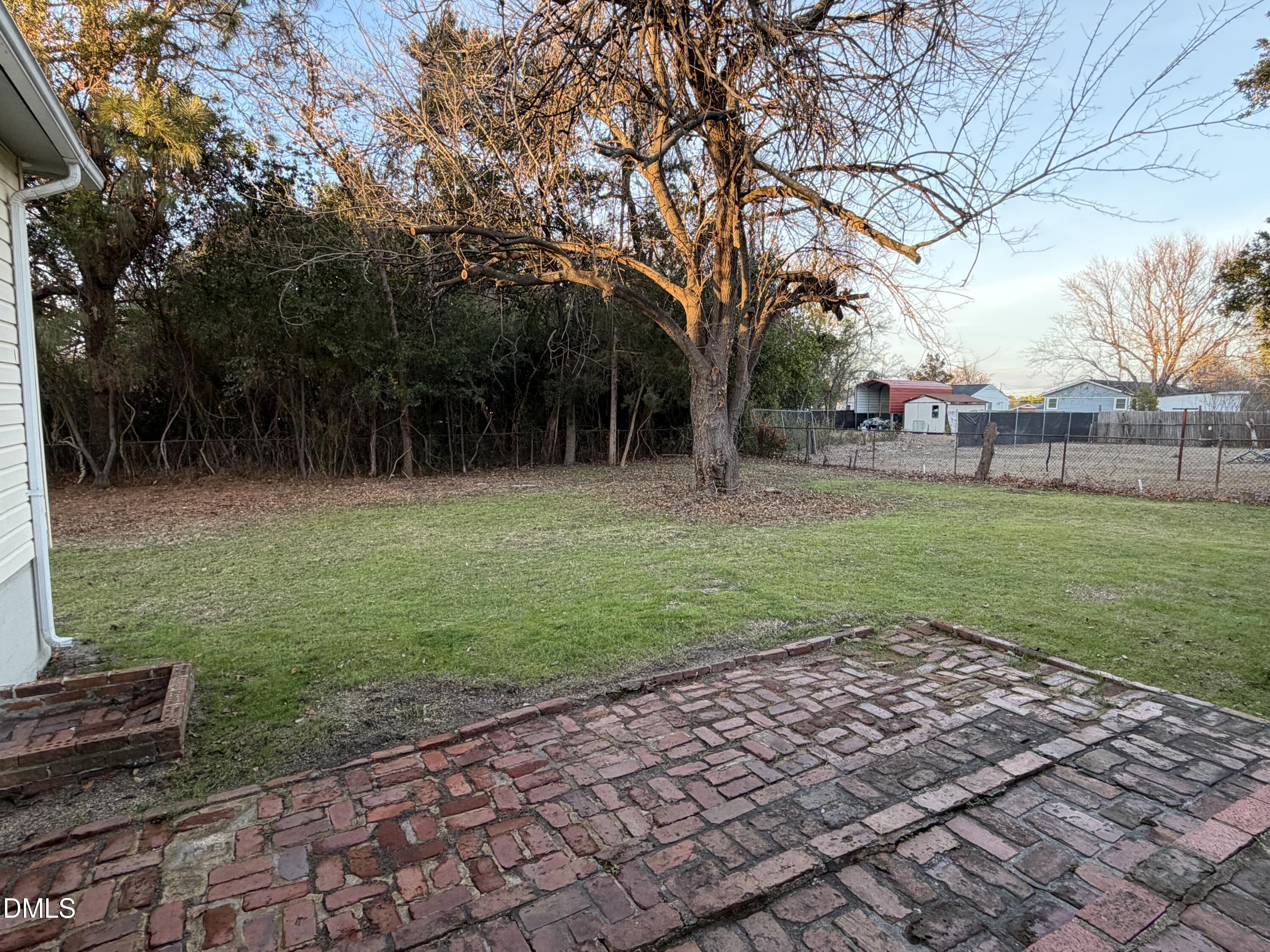 503 Spring Avenue Spring Lake, NC 28390 - Photo 32 of 36 a backyard of a house with lots of green space