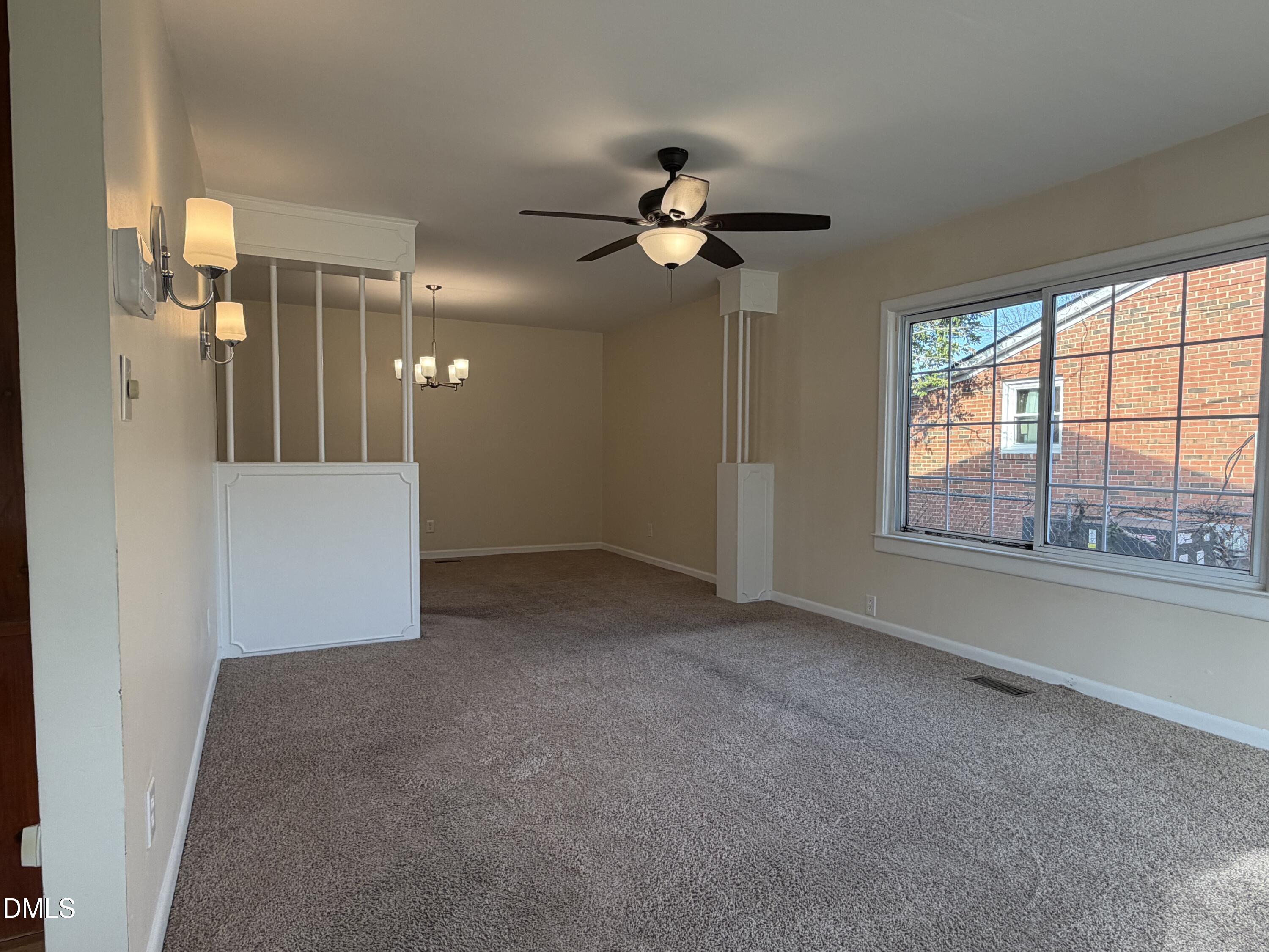 503 Spring Avenue Spring Lake, NC 28390 - Photo 5 of 36 a view of a livingroom with a ceiling fan and window