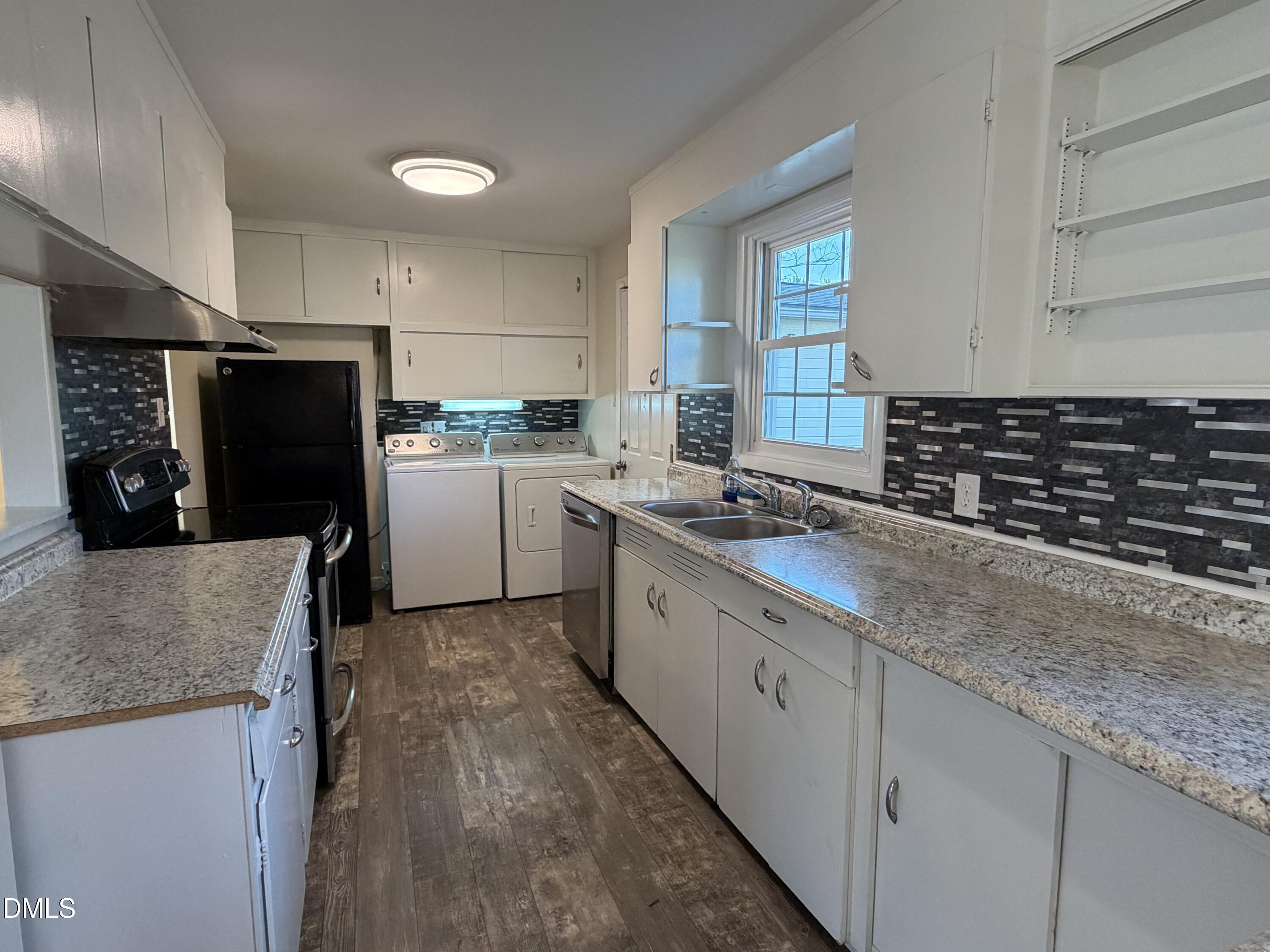 503 Spring Avenue Spring Lake, NC 28390 - Photo 9 of 36 a kitchen with a sink stove and refrigerator