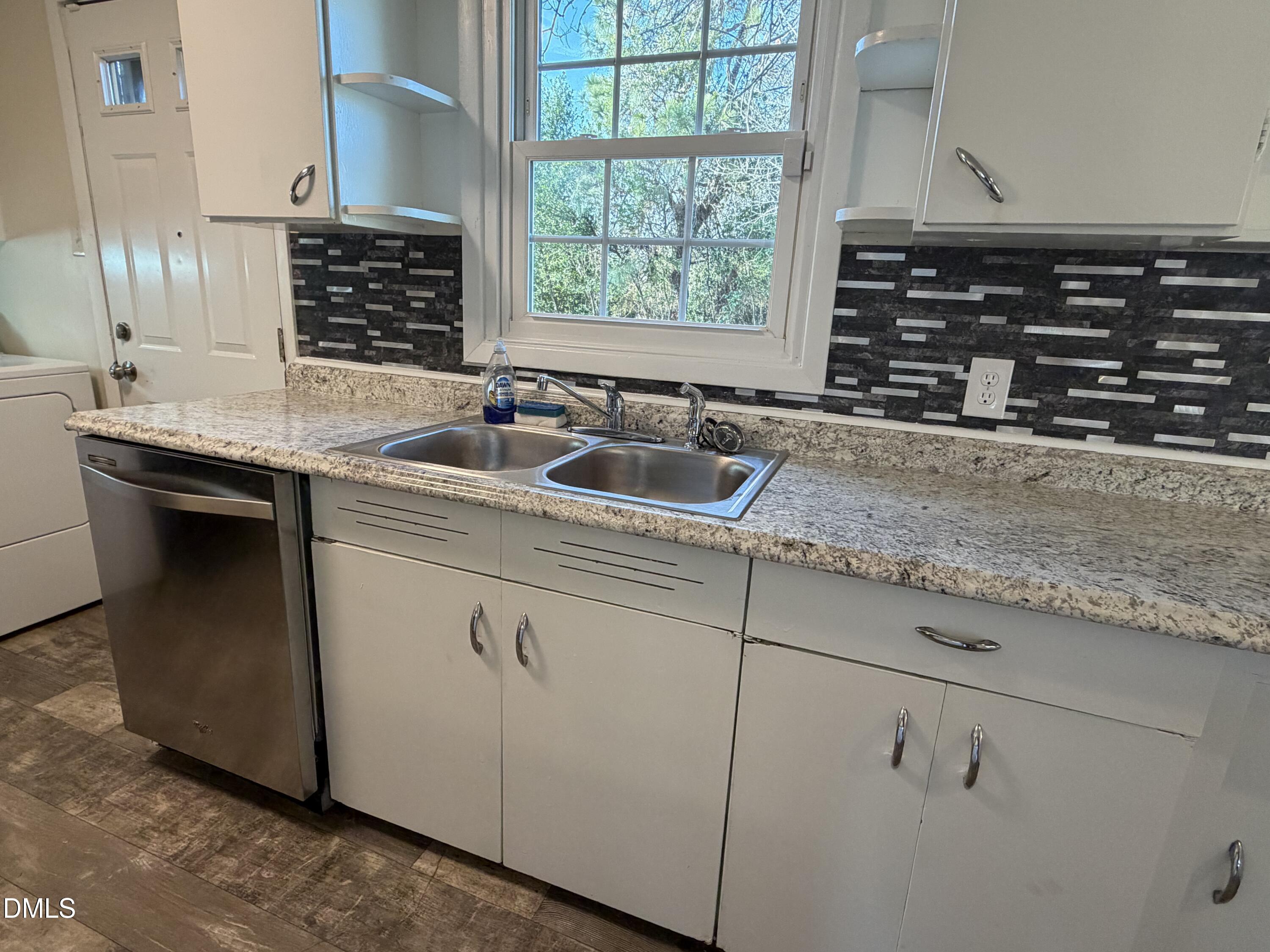 503 Spring Avenue Spring Lake, NC 28390 - Photo 10 of 36 a kitchen with granite countertop a sink and a stove