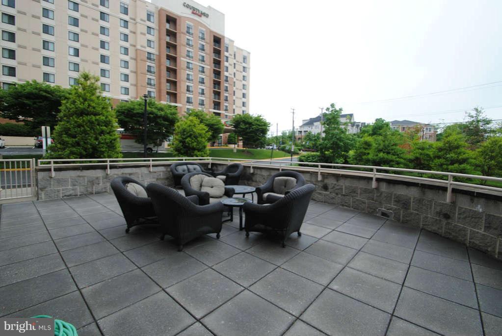 2726 Gallows Road, Unit 901 Vienna, VA 22180 - Photo 13 of 13 a view of roof deck with couches and potted plants