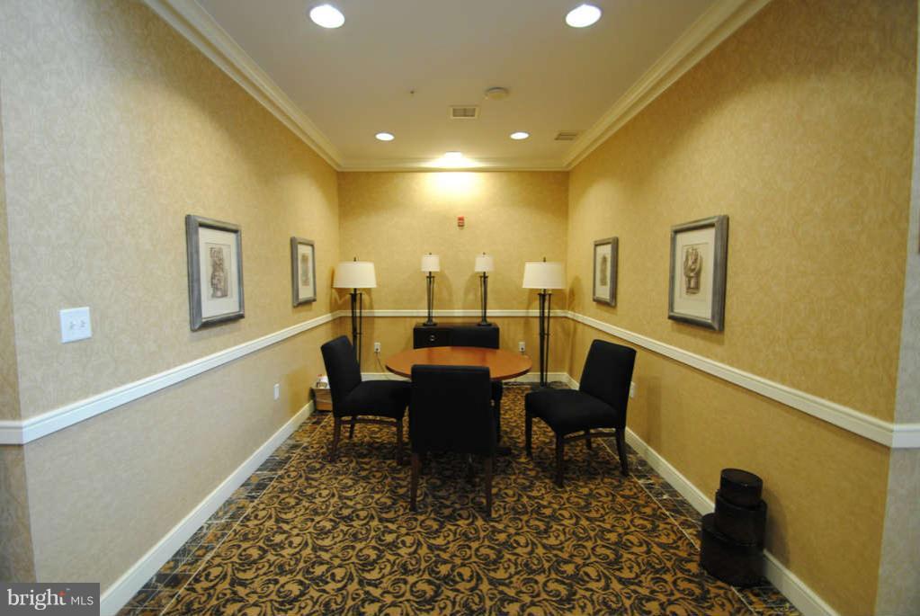2726 Gallows Road, Unit 901 Vienna, VA 22180 - Photo 8 of 13 a view of a dining room with furniture