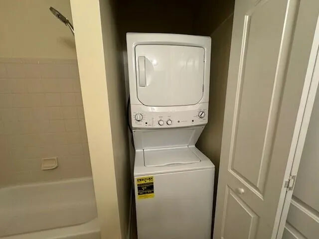 a living room with furniture gym equipment and view of living room