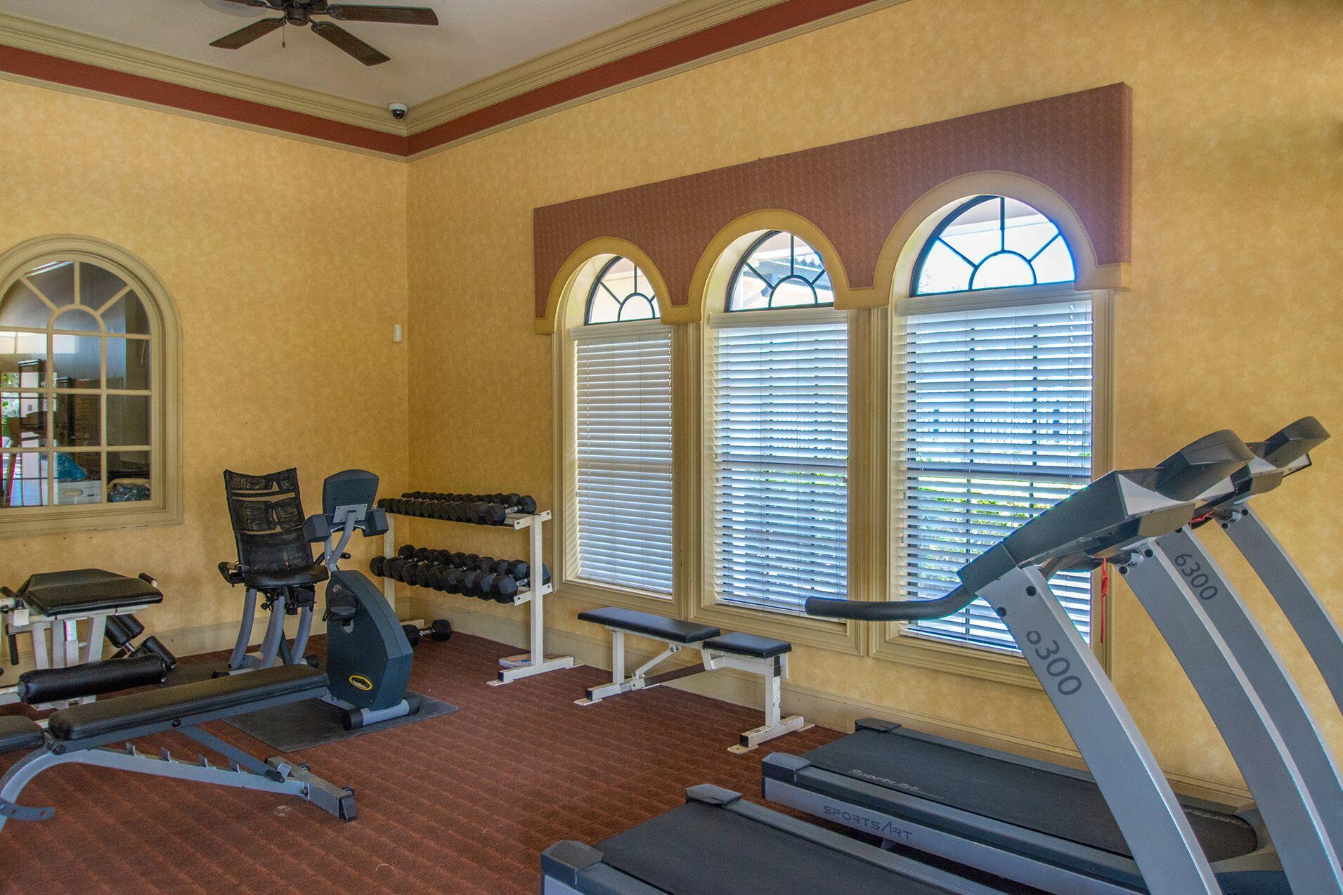 6441 Borasco Drive, Unit 2404 Melbourne, FL 32940 - Photo 17 of 28 a view of a room with gym equipment