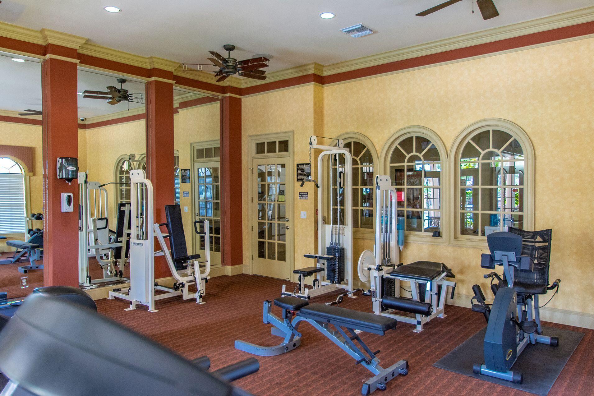 6441 Borasco Drive, Unit 2404 Melbourne, FL 32940 - Photo 18 of 28 a view of a livingroom with furniture and gym equipment