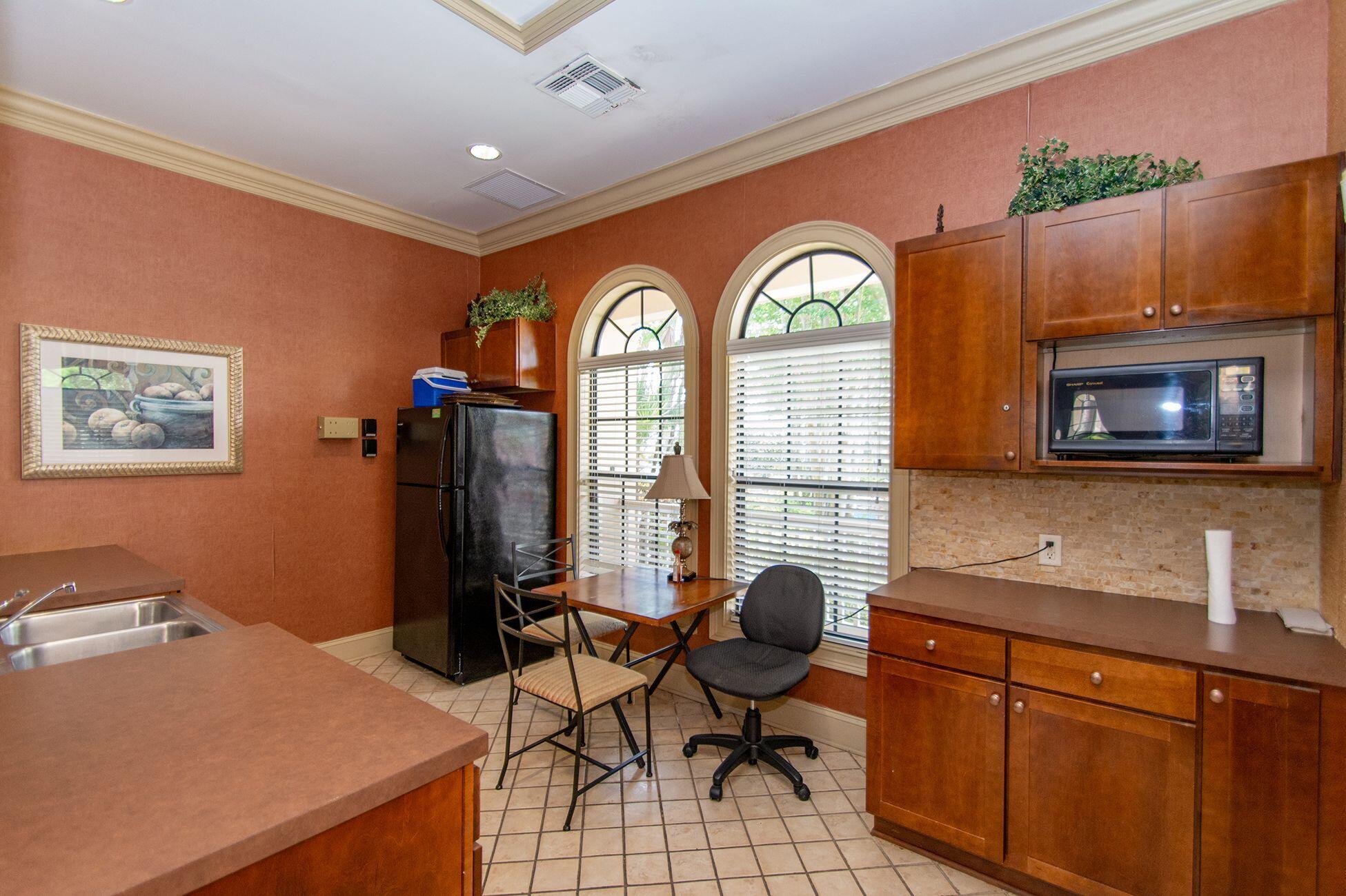 6441 Borasco Drive, Unit 2404 Melbourne, FL 32940 - Photo 21 of 28 a view of a livingroom with workspace and a window