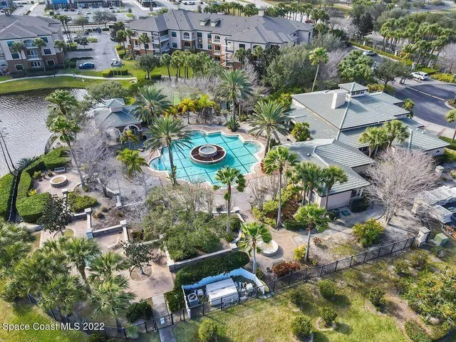 a view of a porch with furniture and a grill