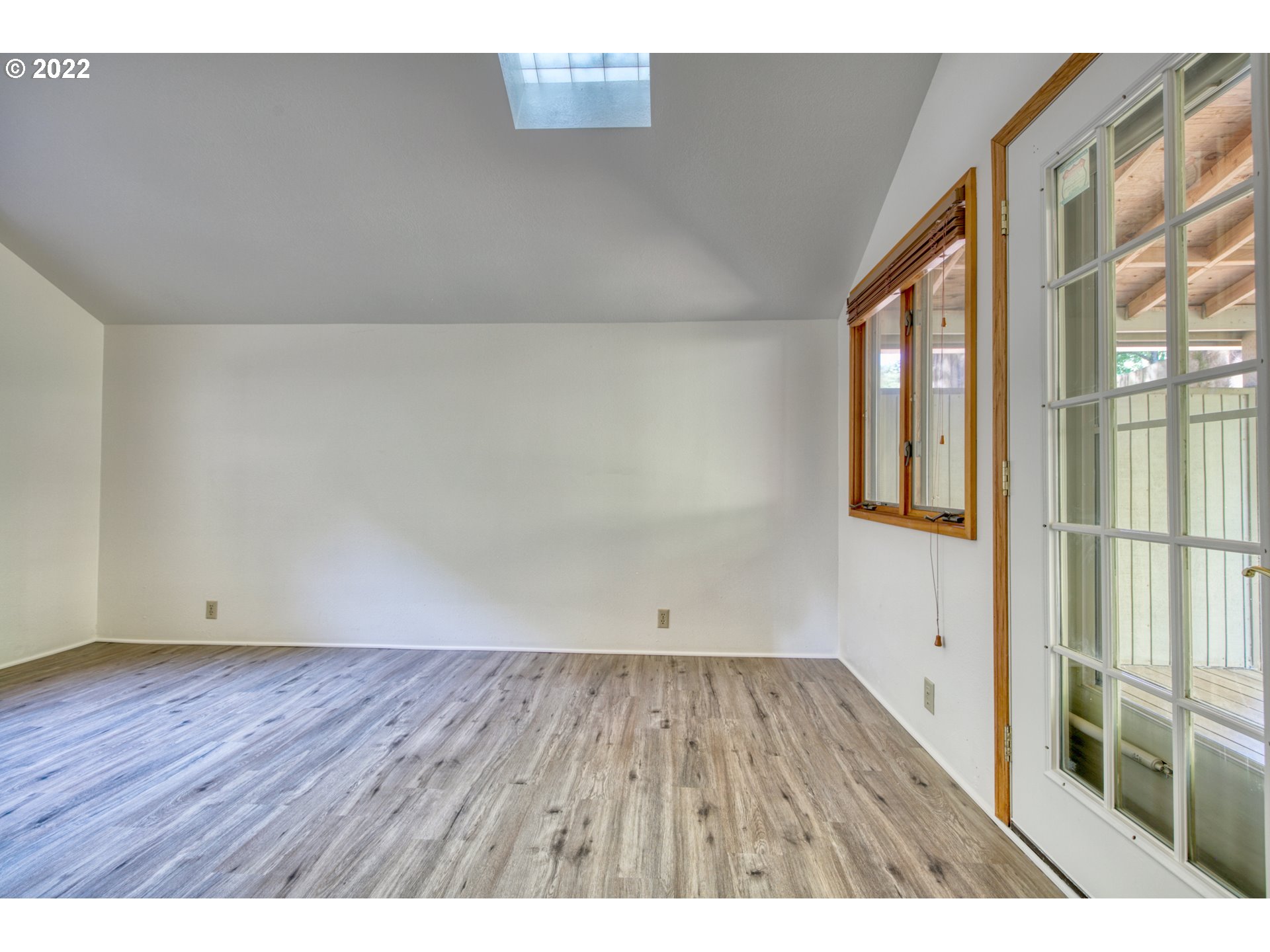 37821 Shenandoah Loop Springfield, OR 97478 - Photo 17 of 32 a view of an empty room with wooden floor and a window