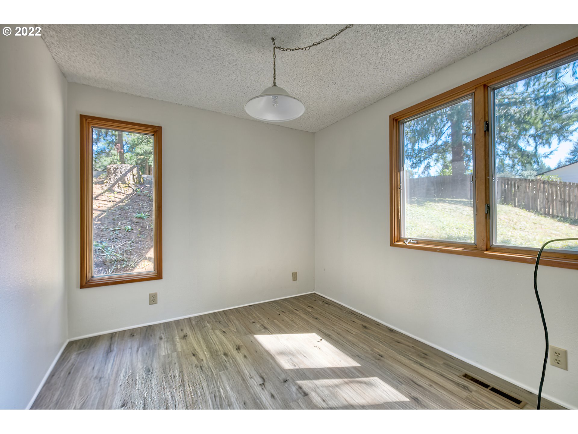 37821 Shenandoah Loop Springfield, OR 97478 - Photo 20 of 32 a view of an empty room with a window and wooden floor