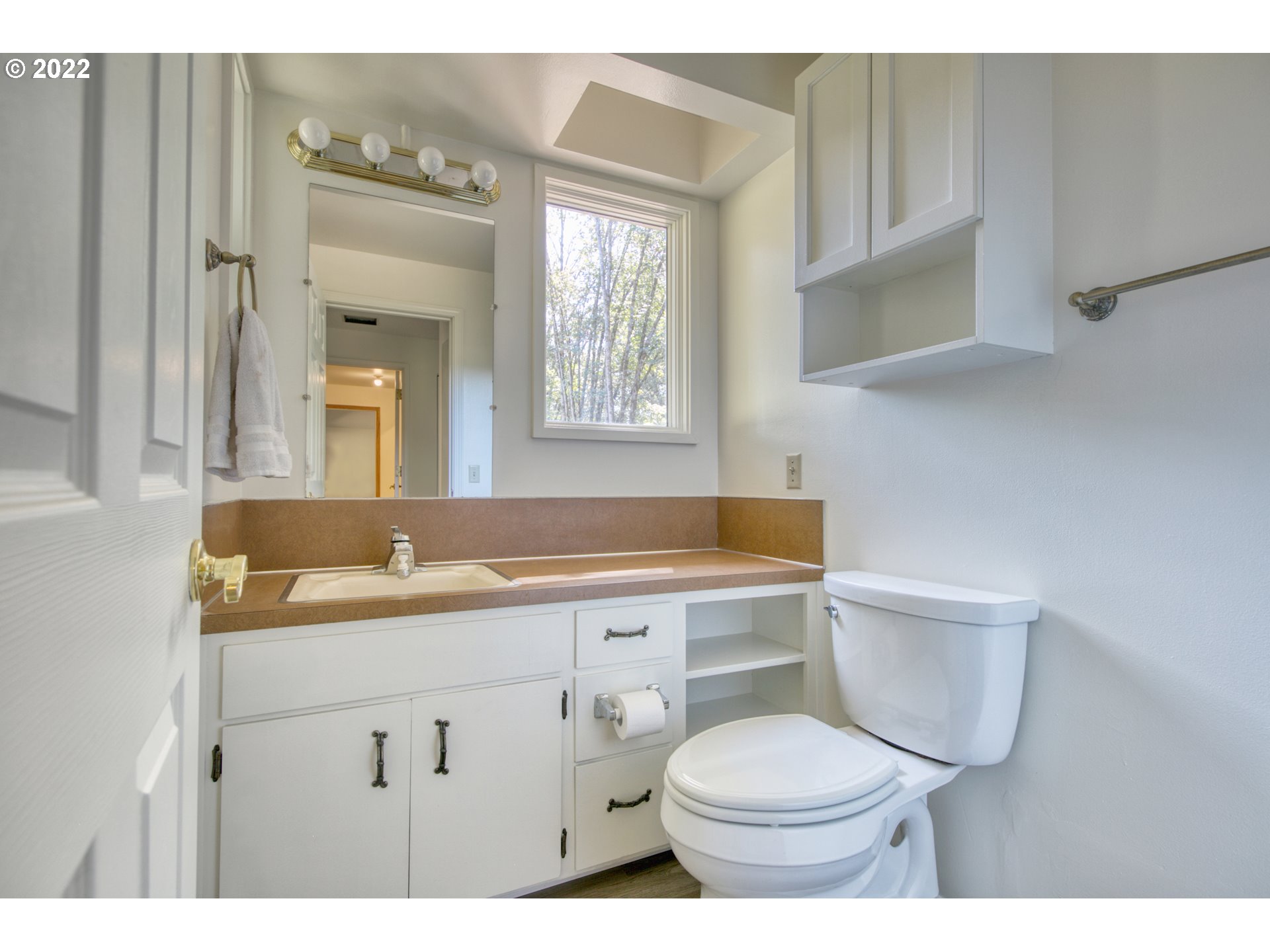 37821 Shenandoah Loop Springfield, OR 97478 - Photo 21 of 32 a bathroom with a granite countertop toilet sink and mirror