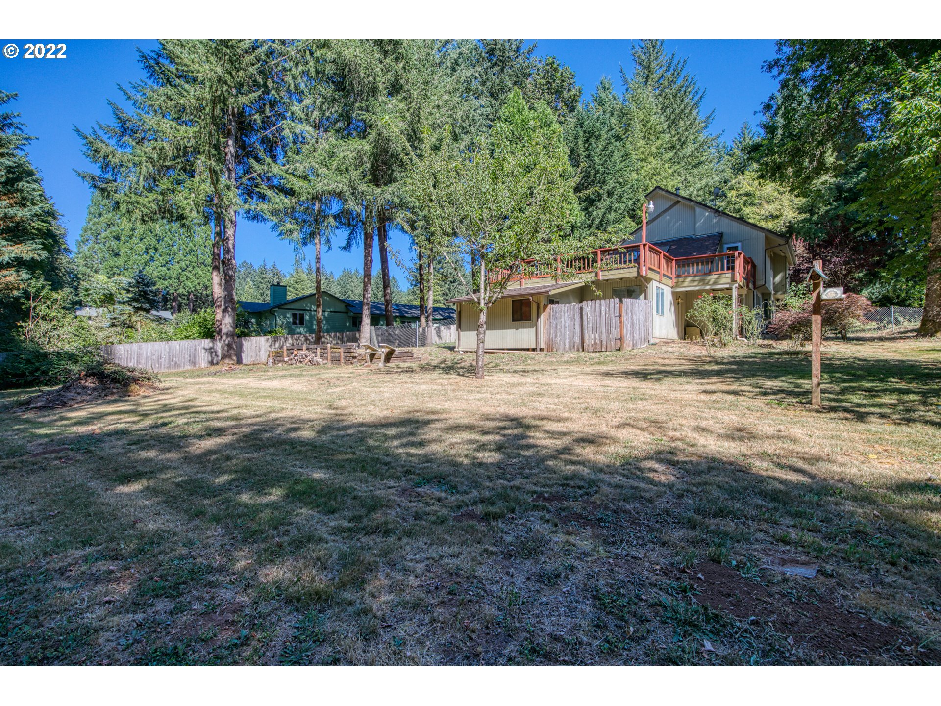37821 Shenandoah Loop Springfield, OR 97478 - Photo 28 of 32 a row of palm trees in front of a house