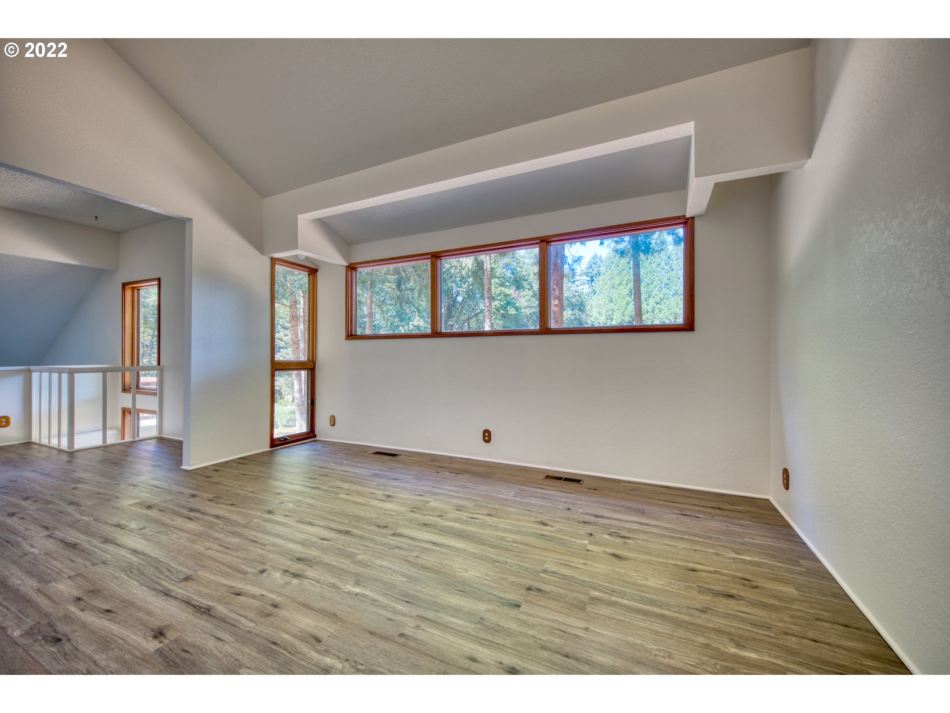 37821 Shenandoah Loop Springfield, OR 97478 - Photo 9 of 32 a view of an empty room with wooden floor and a window