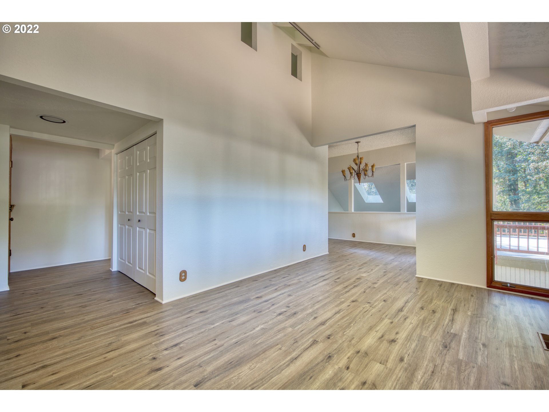 37821 Shenandoah Loop Springfield, OR 97478 - Photo 10 of 32 a view of an empty room with wooden floor and a window