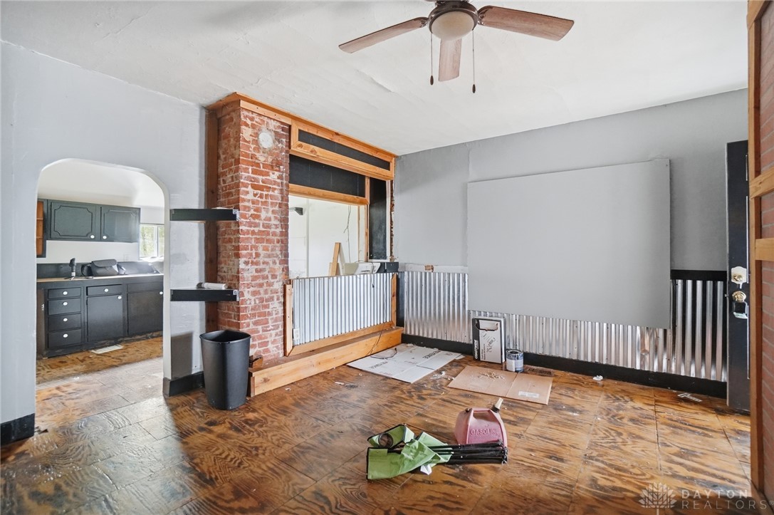 517 Broadway Street, Unit 515 Springfield, OH 45504 - Photo 6 of 29 This interior space boasts a unique brick column and warm wood flooring.