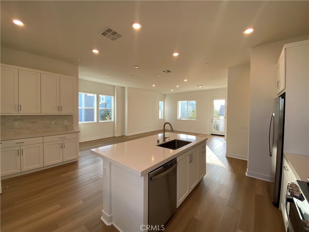194 Sash Irvine, CA 92618 - Photo 7 of 18 a kitchen with stainless steel appliances granite countertop a sink and stove