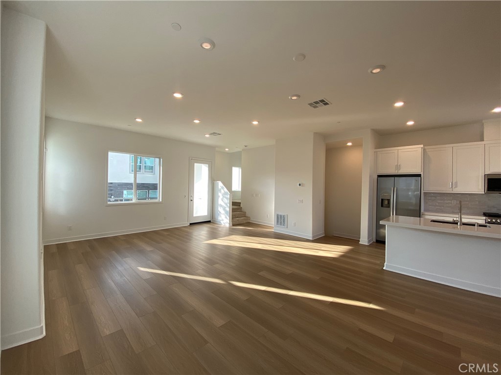 194 Sash Irvine, CA 92618 - Photo 9 of 18 a view of an empty room with kitchen appliances and a window