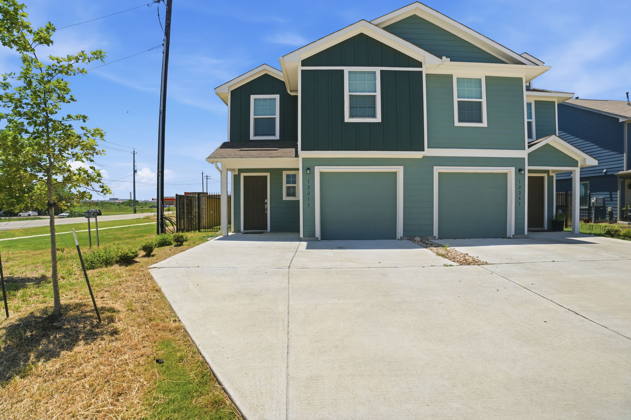12213 Rising Moon Lane Del Valle, TX 78617 - Photo 1 of 19 a front view of a house with a yard