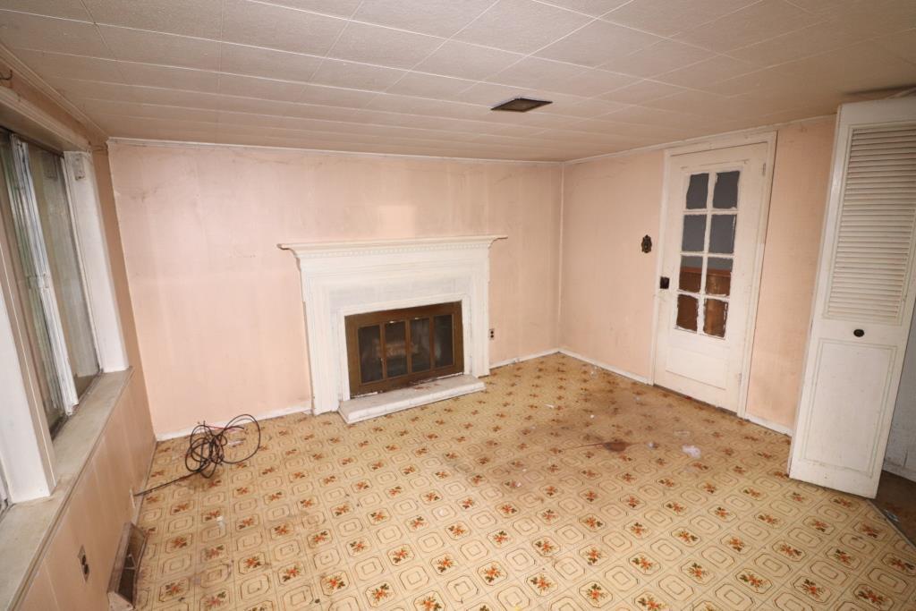 4428 Keefer Road Roanoke, VA 24018 - Photo 21 of 21 a bedroom with a bed and a fireplace