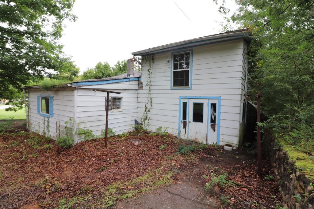 4428 Keefer Road Roanoke, VA 24018 - Photo 8 of 21 a backyard of a house with plants and large tree