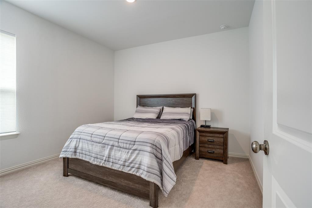 15603 Palmwood Road Frisco, TX 75033 - Photo 11 of 12 a bedroom with a bed and a window