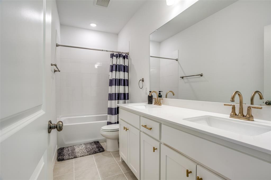 15603 Palmwood Road Frisco, TX 75033 - Photo 12 of 12 a bathroom with a sink toilet tub and shower