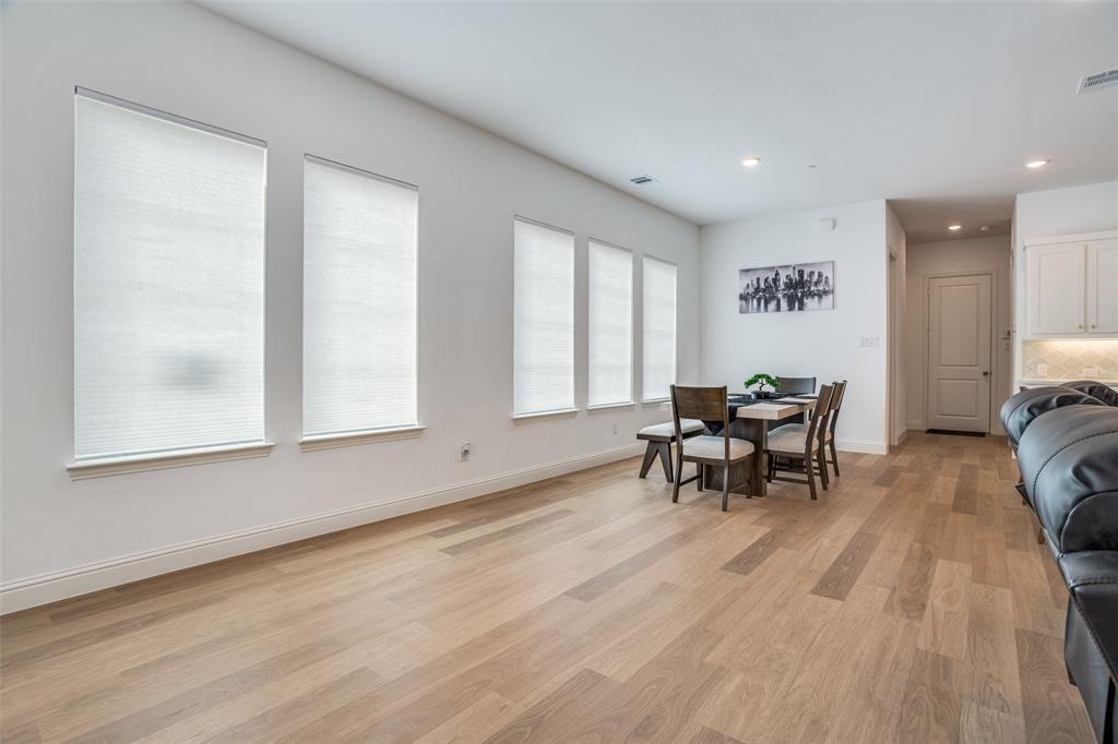 15603 Palmwood Road Frisco, TX 75033 - Photo 2 of 12 a view of a room with dining room and wooden floor