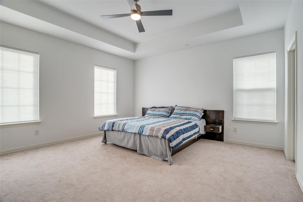 15603 Palmwood Road Frisco, TX 75033 - Photo 8 of 12 a spacious bedroom with a bed and a window