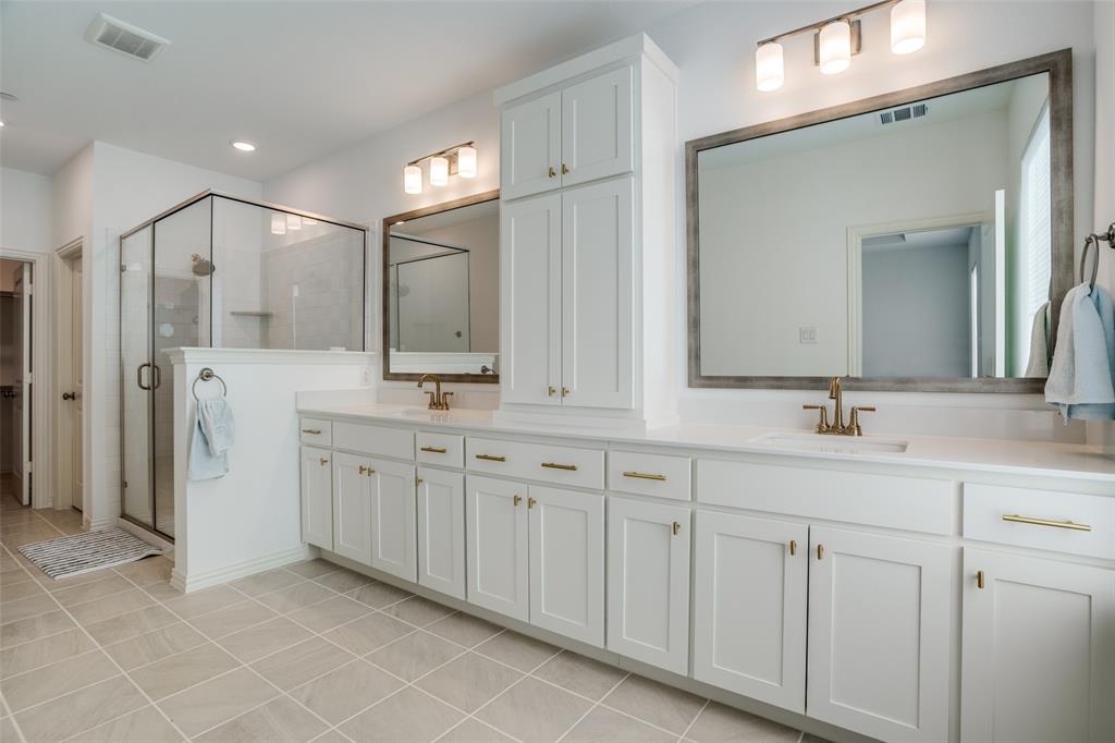 15603 Palmwood Road Frisco, TX 75033 - Photo 9 of 12 a spacious bathroom with double sink and a mirror