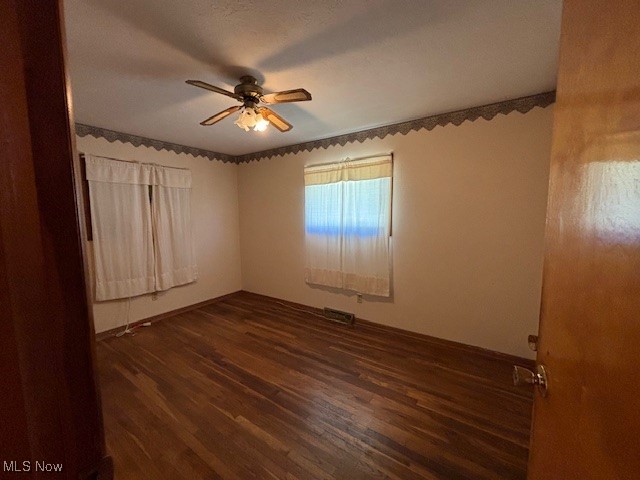4337 Graph Road Northwest Dellroy, OH 44620 - Photo 10 of 10 Unfurnished room featuring dark wood-style flooring and a ceiling fan