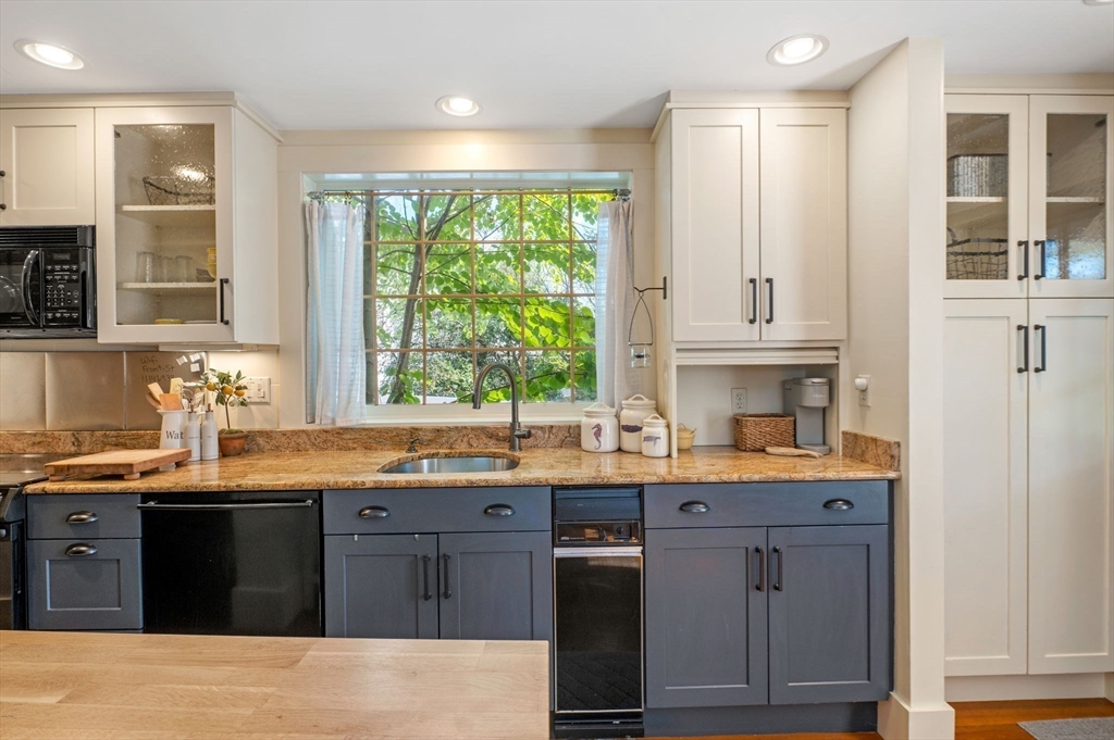 29 Front Street, Unit 2 Marblehead, MA 01945 - Photo 13 of 38 a kitchen with granite countertop a sink and a window