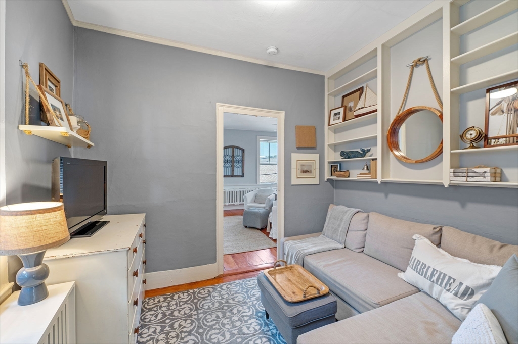 29 Front Street, Unit 2 Marblehead, MA 01945 - Photo 18 of 38 a living room with furniture a rug and a fireplace