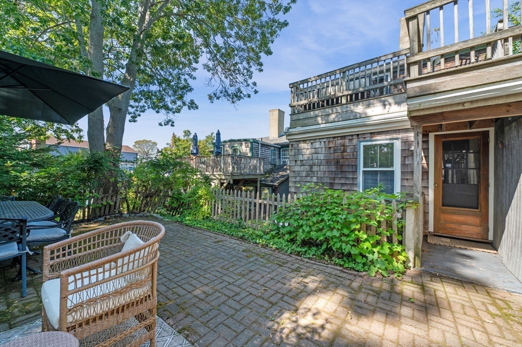 29 Front Street, Unit 2 Marblehead, MA 01945 - Photo 26 of 38 a view of a chair and table in the patio