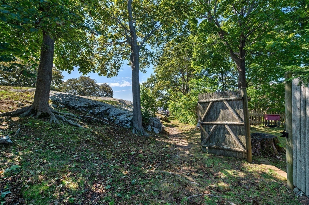 29 Front Street, Unit 2 Marblehead, MA 01945 - Photo 29 of 38 a backyard of a house with table and chairs