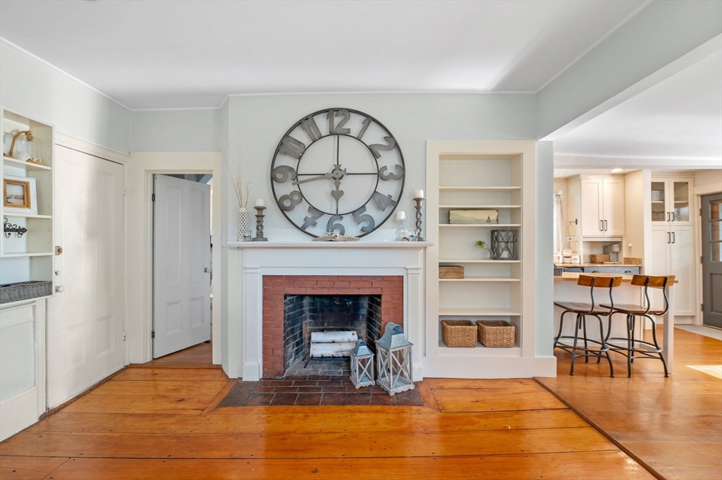 29 Front Street, Unit 2 Marblehead, MA 01945 - Photo 8 of 38 a view of a livingroom with furniture a fireplace and wooden floor