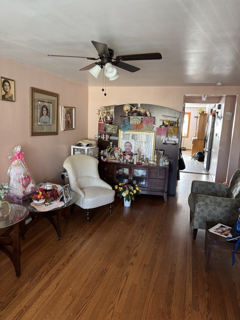 7836 Monitor Avenue Burbank, IL 60459 - Photo 24 of 26 a living room with furniture and a wooden floor