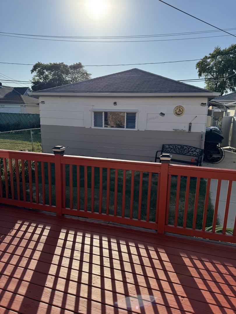 7836 Monitor Avenue Burbank, IL 60459 - Photo 7 of 26 a view of a balcony with wooden floor