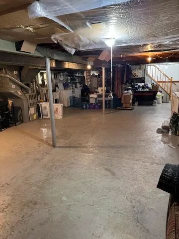 a view of parking garage with cars