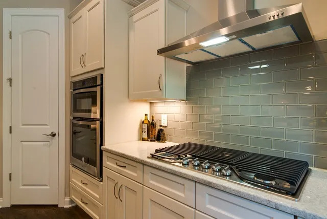 a kitchen with a sink and cabinets