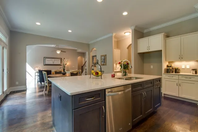 a view of a hallway with wooden floor and closet