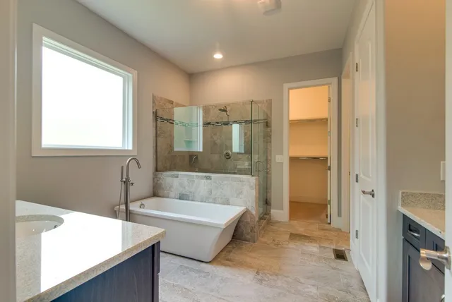 a bathroom with a sink double vanity and a mirror