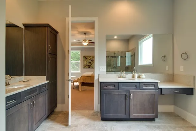 a bathroom with a bath tub with a shower