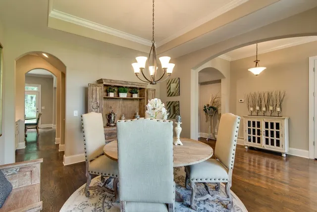a view of a livingroom with furniture and wooden floor